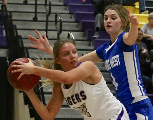 Lemoore's Tori Sheldon faces off with Hanford West's Kolbi Adams in Tuesday night's victory over visiting Hanford West.
